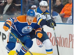 Edmonton Oilers defenceman Oscar Klefbom rubs out Alexander Steen of the St. Louis Blues during Saturday’s National Hockey League game at Rexall Place.