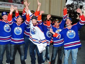 Edmonton Oilers fans show their excitement at the team’s 2014-15 home opener at Rexall Place on Oct. 9, 2014.
