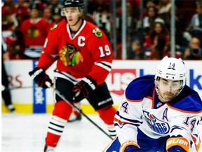 Edmonton Oilers forward Jordan Eberle advances with the puck against the Chicago Blackhawks during NHL action on Nov. 10, 2013, in Chicago.