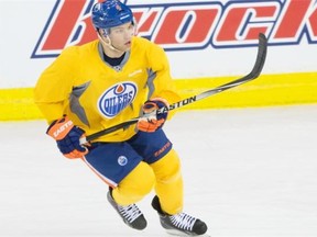 Edmonton Oilers forward Taylor Hall wears a yellow non-contact jersey during practice at Rexall Place in Edmonton on March 17, 2015. Hall shed the yellow uniform on March 20 and took contact in practice as he prepares to return to the lineup from injury.