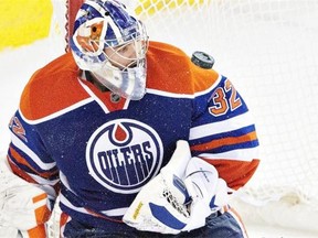 Edmonton Oilers goalie Richard Bachman makes a save against the Dallas Stars during NHL action at Edmonton’s rexall Place on March 27, 2015.
