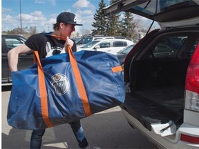 Edmonton Oilers goalie Ben Scrivens packs his vehicle with gear at locker clean-out day at Rexall Place in Edmonton on April 12, 2015.