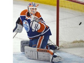 Edmonton Oilers goalie Ben Scrivens (30) watches Winnipeg Jets third goal go in during NHL action at Rexall Place in Edmonton, March 23, 2015.