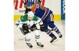 Edmonton Oilers Ryan Nugent-Hopkins (93) gets hooked by Dallas Stars and former Oiler Shawn Horcoff (10) during NHL action at Rexall Place in Edmonton, March 28, 2015.