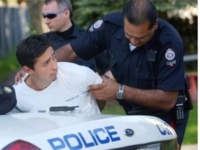 Edmonton police arrest Russell Dean Ominayak in June 2003. Declared a dangerous offender, he was denied parole this week.