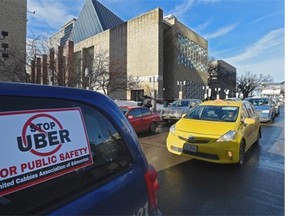 Edmonton taxi drivers stage a protest earlier this year over concerns about unfair competition from Uber.