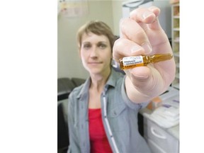 Erica Schoen, nurse educator with Streetworks at Boyle Street Community Services, poses with a vial of naloxone in Edmonton on March 31, 2015. A growing number of fentanyl deaths has led Alberta’s chief medical officer of health to consider dispensing naloxone, an antidote proven to reverse the effects of opioid overdoses, across the province. Streetworks was the first in Canada to distribute the antidote 10 years ago.