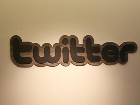 This March 11, 2011 file photo shows the Twitter logo displayed at the entrance of Twitter headquarters in San Francisco,California.