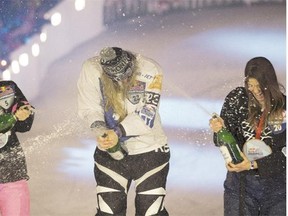 Finnish skater Salla Kyhala, centre, celebrates her win with Canadians Elaine Topolnisky,  left, and Tamara Kajah in the women’s Red Bull Crashed Ice event on March 14, 2015, in Edmonton.