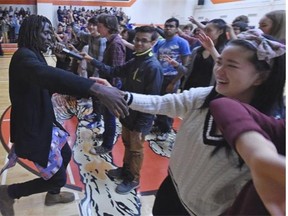 Former child soldier Emmanuel Jal speaks to students at McNally High School in Edmonton on Thursday, March 19, 2015. (Photo by John Lucas/Edmonton Journal)