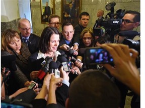 Former Wildrose now PC, MLA Danielle Smith is scrummed in the hallway going into the first day of the session at the Alberta Legislature in Edmonton, March 10, 2015.