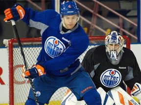 Forward Taylor Hall and goalie Richard Bachman at Edmonton Oilers practice at Rexall Place in Edmonton on March 23, 2015.