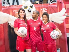 From left, Emily Zurrer, Jonathan De Guzman and Desiree Scott show off the new Umbro Canada kit for the national teams that Soccer Canada unveiled on Friday.