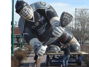 Gareth McKeavney of All-star RV inflates a giant sized Edmonton Rush Player in the breeze in front of United Cycle on the south side in Edmonton on April 17, 2015. The Rush’s host the Colorado Mammoth at Rexall Place on April 18 at 7 p.m.
