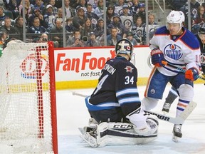 Goaltender Michael Hutchinson #34 of the Winnipeg Jets reacts after Nail Yakupov #10 of the Edmonton Oilers scores a first-period goal on Feb. 16, 2015, at the MTS Centre in Winnipeg.