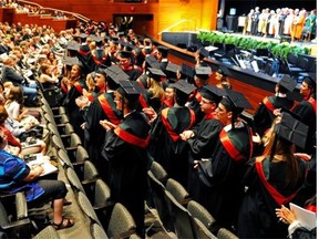 Law graduates applaud their families and friends at the Jubilee Auditorium when the University of Alberta’s Faculty of Law convocated in June 2013.