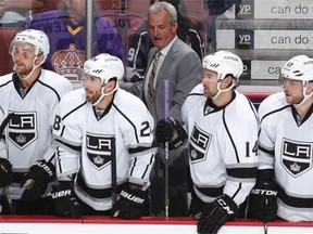 Head coach Darryl Sutter of the Los Angeles Kings talks to his players on the bench playing against the Anaheim Ducks on Feb. 27, 2015, at Honda Center in Anaheim, Calif.