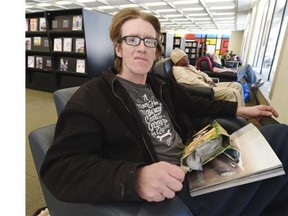 Homeless man Darren Richards spends time in the Stanley A. Milner Library in Edmonton on Monday, April 13, 2015.