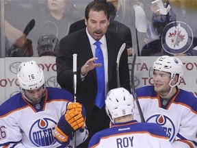 Interim head coach Todd Nelson of the Edmonton Oilers gives direction from the bench in third-period action in an NHL game against the Winnipeg Jets at the MTS Centre on Feb. 16, 2015, in Winnipeg.