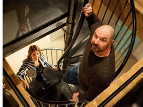 Interior designer Michelle Law, left, and Bob Lalonde pose for a photo in Bob’s historic two-storey condo.