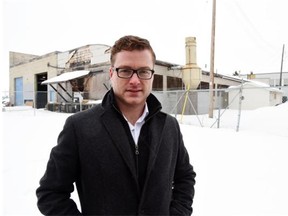 Jarrett Campbell of Brookfield Residential stands in front of buildings that will be torn down. Land immediately south of the Stadium LRT station between Commonwealth Stadium and Jasper Avenue has been sold to Brookfield Residential. The company plans to develop the land into a residential and retail/commercial space.