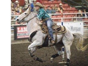 Jaycee Hawk with a time of 21.835 is first in the pole bending at the Canadian College Finals rodeo in Edmonton, March 26, 2015.