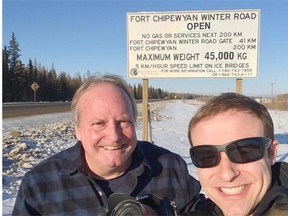 Journal reporter Marty Klinkenberg (left) and photographer Ryan Jackson pose for a photo nearing the gate to the winter ice road from Fort McMurray to Fort Chipewyan in Northern Alberta on February 4, 2015.