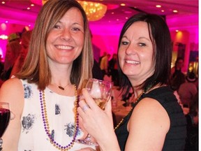 Kelly Dann, left, and Kim Sainchuk at Mardi Gras Carnival on Feb. 27.