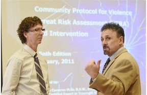 Kevin Cameron (left), trainer from the Canadian Centre for Threat Assessment and Trauma and Frank DeAngeles, retired principal from Columbine school, at a training session for dozens of school district principals and other administrators to recognize safety threats in schools at the Executive Royal Inn in Nisku on Thursday Mar. 5, 2015.