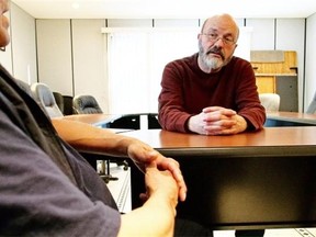 A high-risk sex offender meets with Arthur Dyck, right, the co-ordinator of Circles of Support and Accountability (CoSA) in Edmonton. The federal government last  month cut $7.5 million from the successful program which rehabilitates sex offenders.