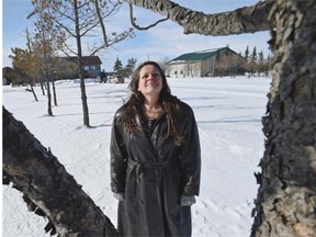 Legal resident and longtime gardener Jodie Foster inspects a row of dying trees north of St. Albert.