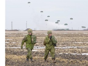 Lieut.-Col. Jay Adair, left, and Sgt. Jordan Taylor were two of the approximately 125 soldiers from the 3rd Battalion, Princess Patricia’s Canadian Light Infantry that conducted training exercises around Josephburg, Alta., 47 kilometres northeast of Edmonton on March 19, 2015. The purpose of the training was to practise airborne skills in the seizure and securing of an airfield objective as well as commemorate the 70th anniversary of Operation VARSITY, a successful Allied Second World War airborne operation in 1945. Some of the paratroopers got to jump from a historic DC-3 Dakota that originally flew with the Royal Air Force (512 Squadron) and inserted paratroopers into Normandy on D-Day and Germany during Operation VARSITY, 70 years ago.