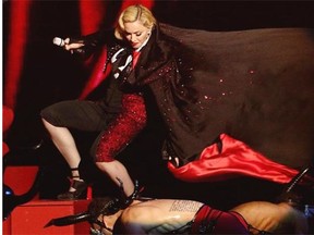 Madonna stumbles while performing on stage during the Brit Awards 2015 at the 02 Arena in London, Wednesday, Feb. 25, 2015.