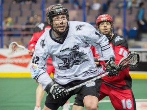 Mark Matthews of the Edmonton Rush runs towards a loose ball during a National Lacrosse League game against the Calgary Roughnecks at Rexall Place on March 8, 2015.