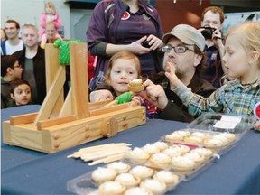 Mark Selsky takes aim with a mini pie in a catapult with sons Braydon (left) and Corbyn (right). The Telus World of Science held a pie-catapulting contest at exactly 9:26:53 a.m. on Saturday, March 14 to celebrate Pi Day, an annual celebration commemorating the mathematical constant (3.14) or 3/14 in month/day format. This year is dubbed the Ultimate Pi Day as the first 10 digits of Pi (3.141592653) will occur during the morning of March 14 or 3/14/15 at 9:26:53 a.m.