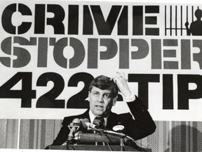 Mayor Cec Purves unveils Edmonton’s latest crime fighting weapon in 1983: the Crime Stoppers program.