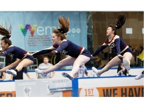 Members of Archbishop Oscar Romero High School cheerleading team take part in the Alberta Cheerleading Championship at West Edmonton Mall on March 6, 2015 despite the fact that 35 teams have withdrawn due to al-Shabab’s terrorism threats on the mall.