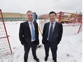 Michael Liu and Robert McLeod of McLeod Project Marketing at the Infiniti project site in Edmonton on Friday, March 20