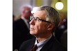 Minister of Finance Robin Campbell waits a television interview to start after he tabled the Alberta Budget 2015 at the Legislature in Edmonton, March 26, 2015.