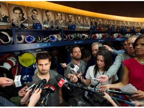 Montreal Canadiens captain Brian Gionta endures a daunting media scrum at the team’s training facility in Brossard, Que. in 2014. Players often revert to a linguistic comfort zone they have learned from interviews of the past with their hockey idols.
