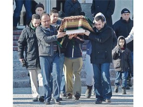 Mourners carry the casket of eight-month-old Zahra, who died from poisoning in Fort McMurray, outside the Al Rashid Mosque in Edmonton, Feb. 26, 2015.