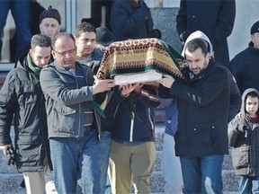 Mourners carrying the casket of eight-month-old Zahra, who died from poisoning in Fort McMurray, out of the Al Rashid Mosque in Edmonton, February 26, 2015.