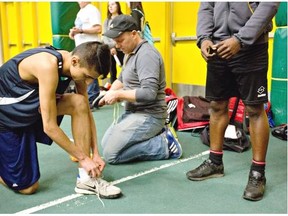 Mujtaba Humayun, left, and coach Craig Harle prepare to race during the Running Room indoor games at the University of Alberta on March 14, 2015.