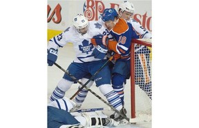 Nail Yakupov (10) battles to the net as the Edmonton Oilers play the Toronto Maple Leafs at Rexall Place in Edmonton on March 16, 2015.