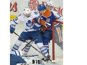 Nail Yakupov (10) battles to the net as the Edmonton Oilers play the Toronto Maple Leafs at Rexall Place in Edmonton on March 16, 2015.