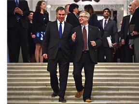 The rotunda is packed with media, politicans, etc.. after the Alberta Budget 2015 was tabled at the Legislature in Edmonton, March 26, 2015.