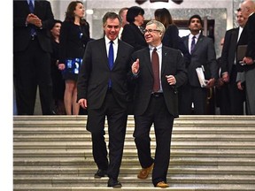 FILE - Former Premier Jim Prentice (left) and Minister of Finance Robin Campbell after the Alberta Budget 2015 was tabled at the Legislature in Edmonton, March 26, 2015