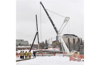 An extra crane has been added to stabilize the load at the site of the 102 Avenue bridge in Edmonton on Friday, March 20, 2015. (Photo by John Lucas/Edmonton Journal)