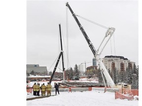 n extra crane has been added to stabilize the load at the site of the 102 Avenue bridge in Edmonton on Friday, March 20, 2015. (Photo by John Lucas/Edmonton Journal)