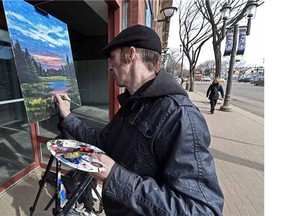 Artist Patrick Ennis took advantage of the nice weather to do some painting and display his works along Whyte Avenue in Edmonton on Friday Mar. 13, 2015.